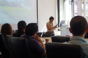 Lecturing woman with audience