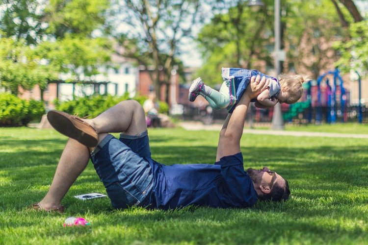 Father with child on meadow