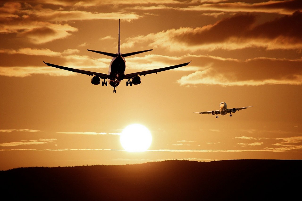  two planes in front of the sunset